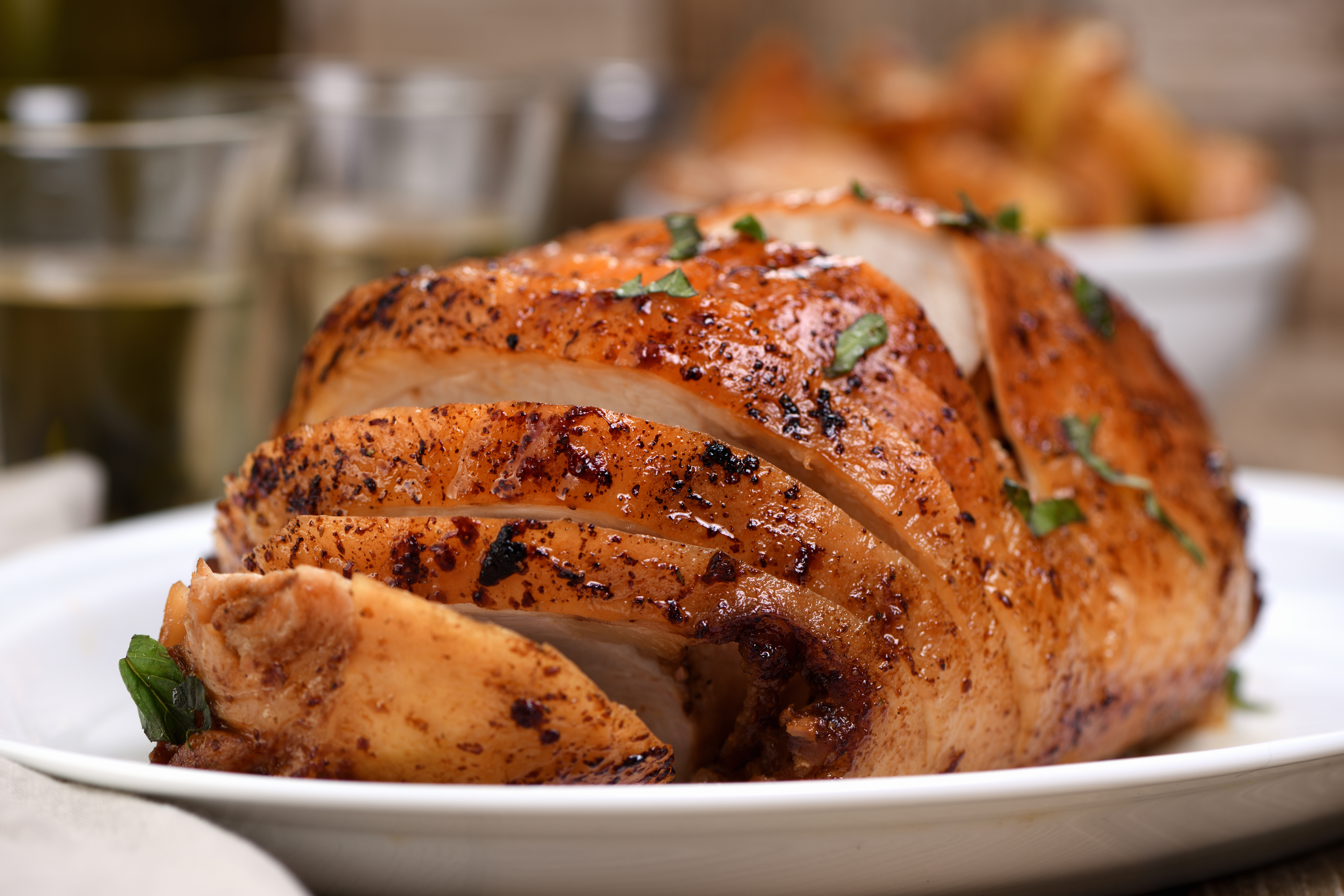 Sliced into slices baked turkey breast close-up